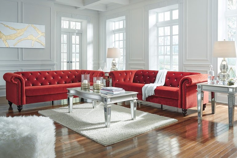 white rug with red couch