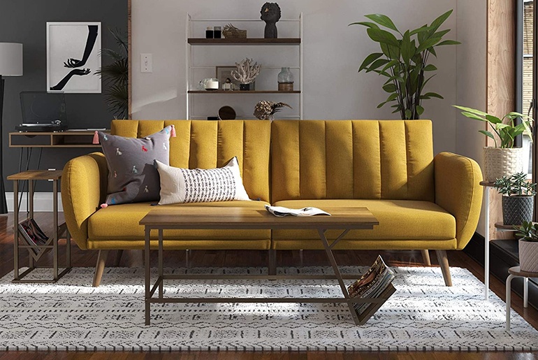 yellow couch with dark floors