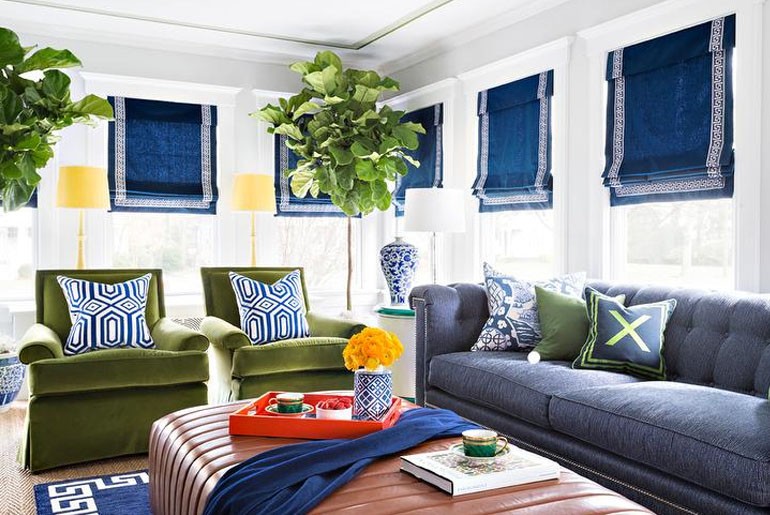 green accent chairs with blue couch